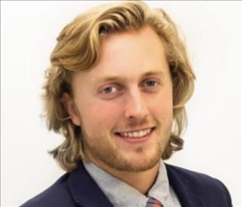 Young man with a jacket and tie on