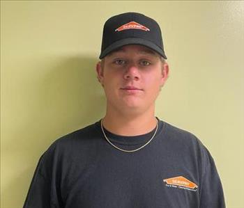 Young man standing in Servpro shirt