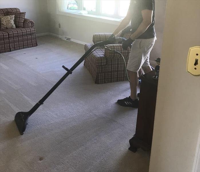 Man cleaning carpet