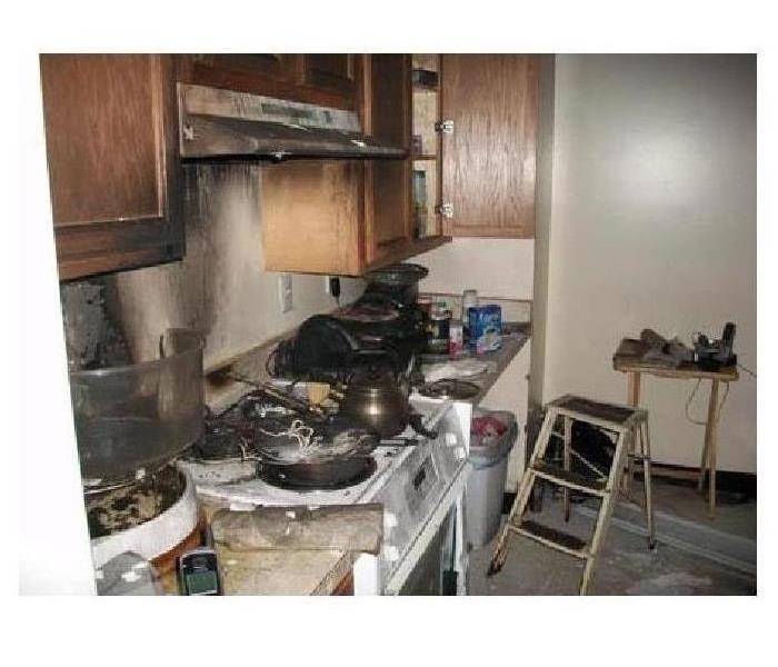 fire in a kitchen, charred elements